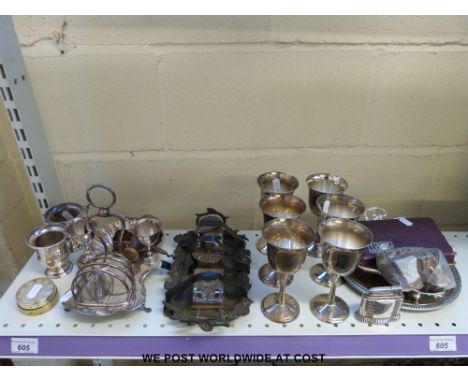 A plated egg cruet and toast rack, brass ink well, goblets, corkscrew etc 