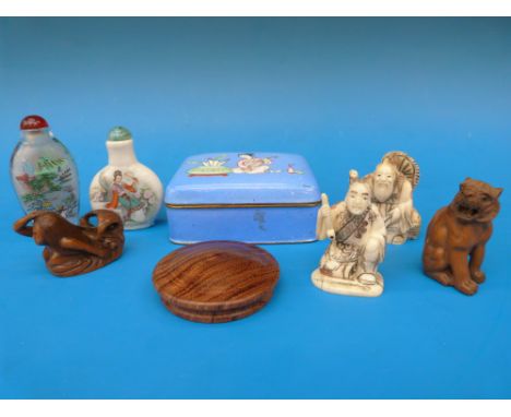 A collection of oriental items to include an enamel box, two snuff bottles, netsukes etc 