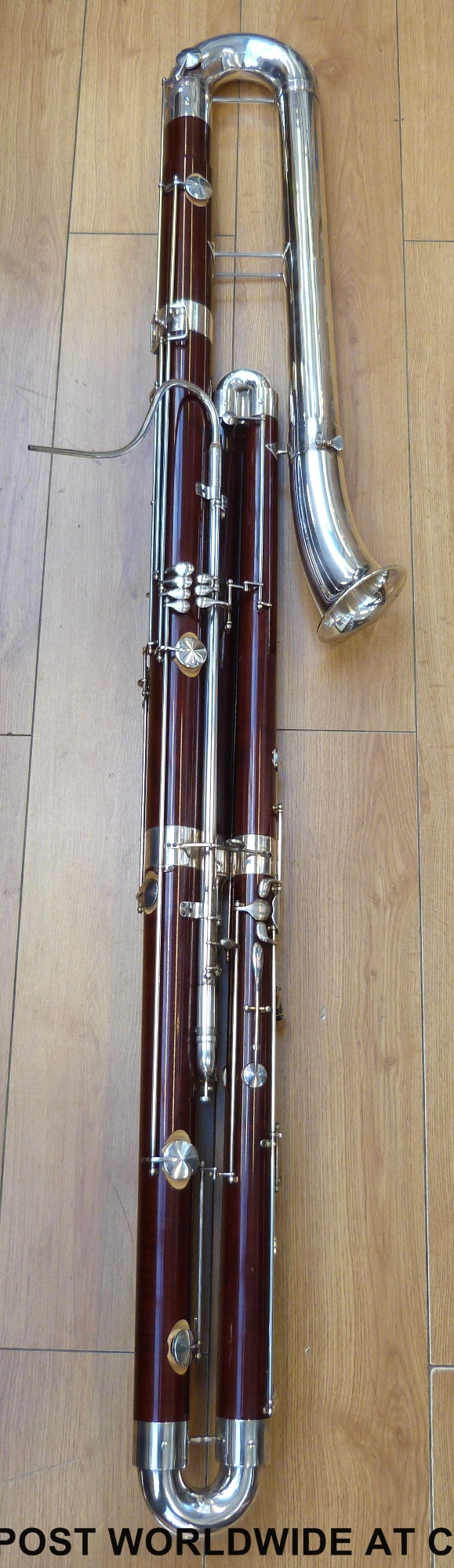 A cased Adler Sonata contrabassoon or double bassoon with maple body