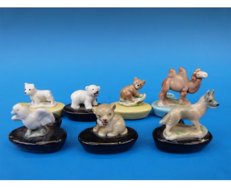 Seven Wade Whimsie miniature candle holders including Westie, polar bear, lion cub etc 