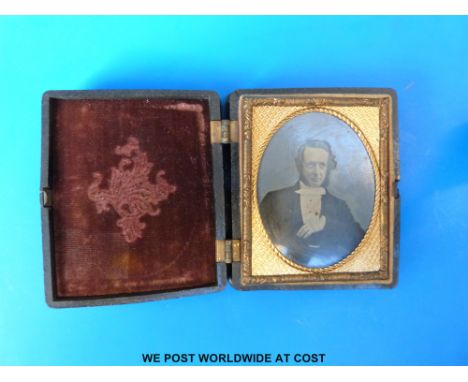 A daguerreotype portrait of gentleman in gilt frame,  housed in deep moulded black case