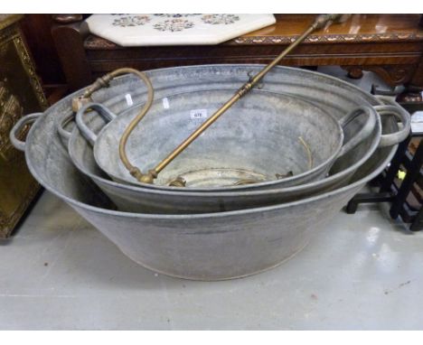 Three graduated tin baths, brass gas light fitting and an embossed brass coal box