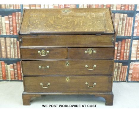 A Georgian oak bureau raised on bracket feet (w93 x d54 x h100) 