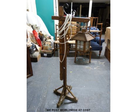 An oak adjustable floor standing hanging or standard lamp