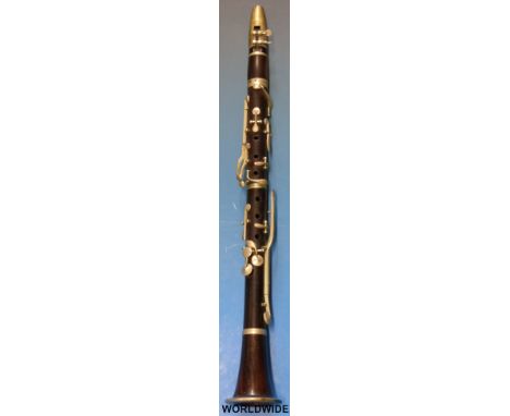 A 19thC rosewood clarinet in original case by Butler, Haymarket London. Comes with a late Victorian photograph of The Bagshot