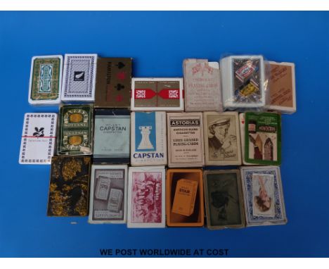 A tray of largely advertising playing cards (shipping lines, cigarettes etc)