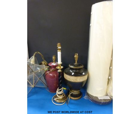 A modern standard lamp together with five various other lamps 